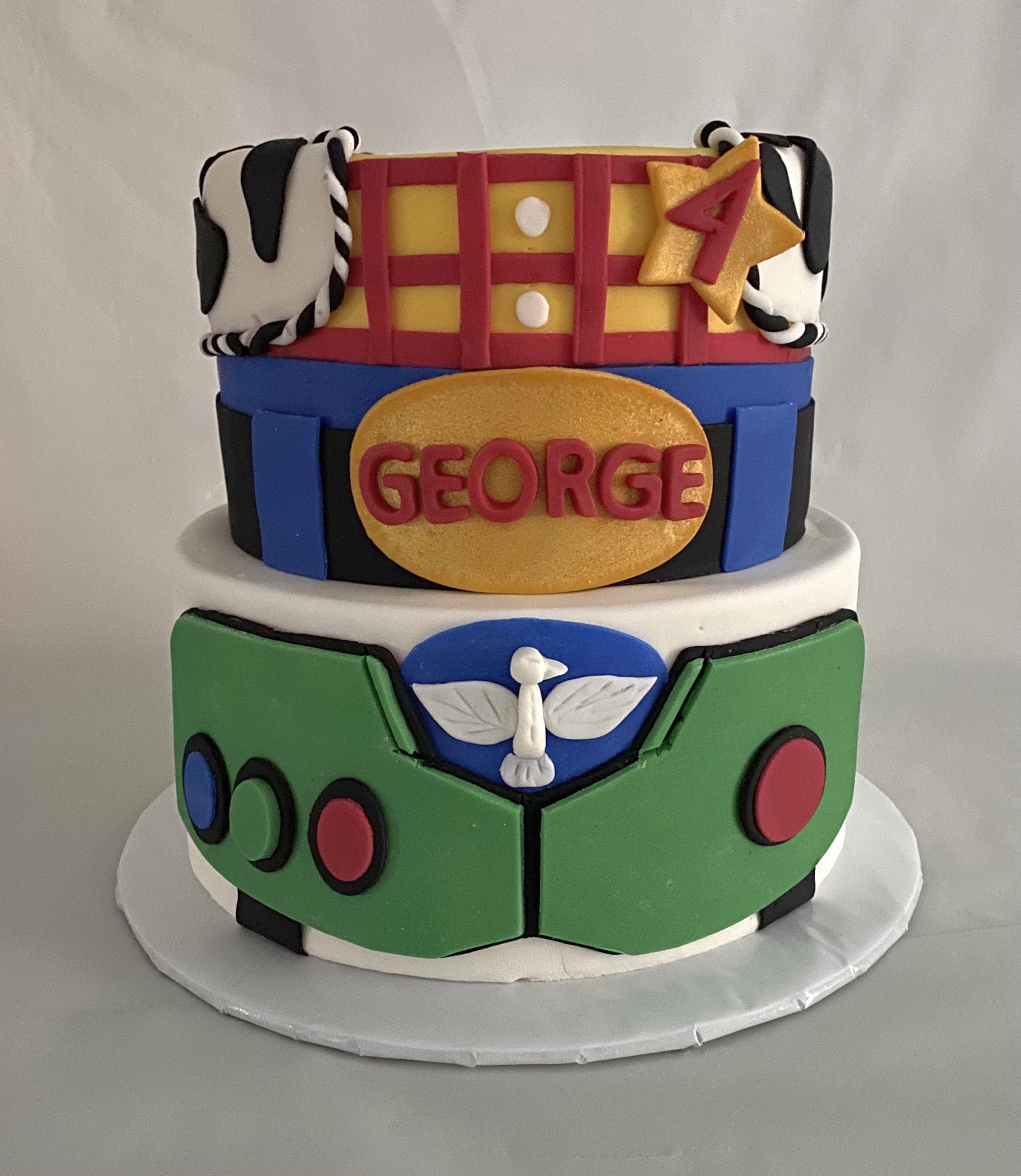 A fantastic movie themed birthday cake with hand-crafted fondant decorations from Village Patisserie in Toledo, Ohio