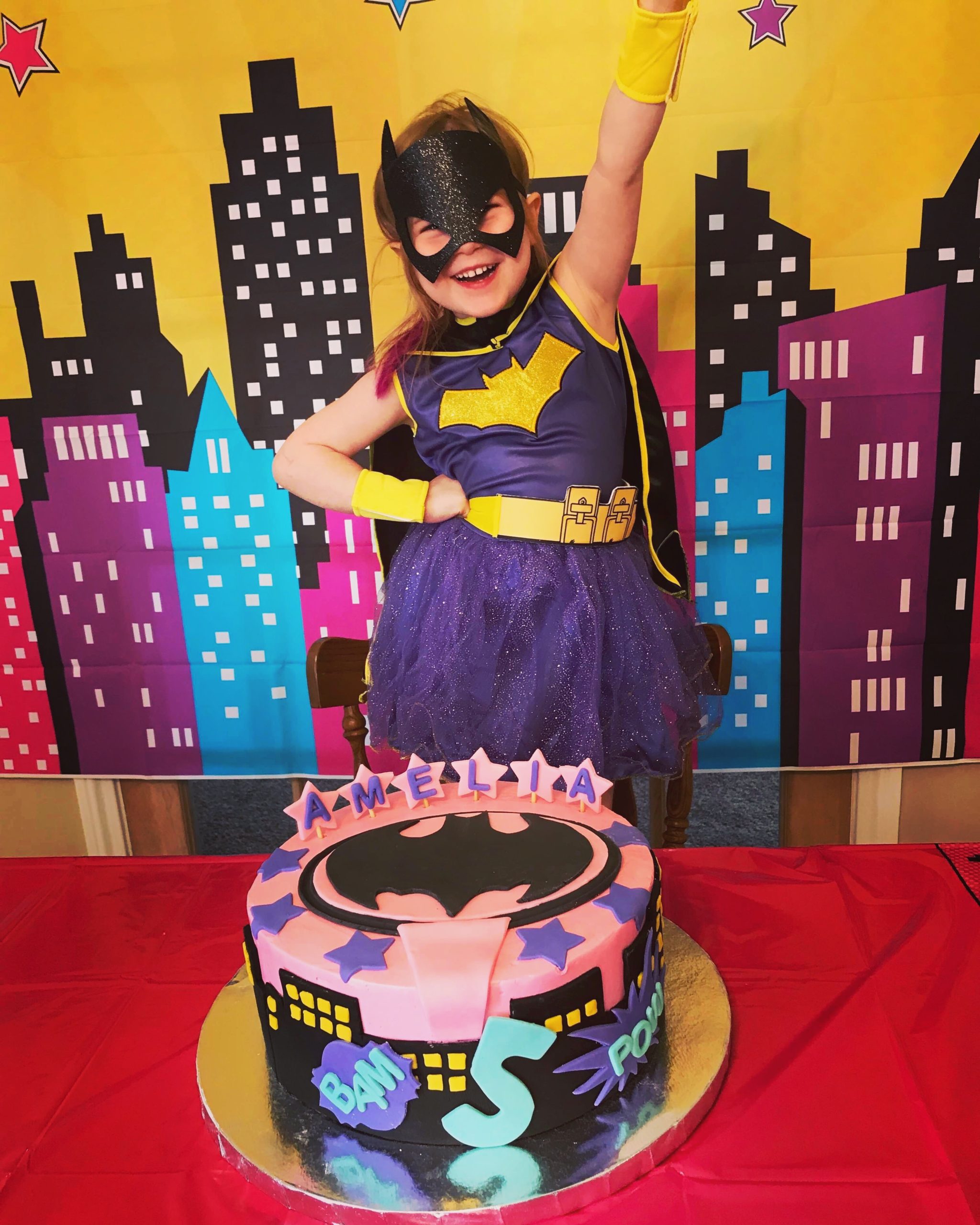 A fantastic super hero themed birthday cake with hand-crafted fondant decorations from Village Patisserie in Toledo, Ohio