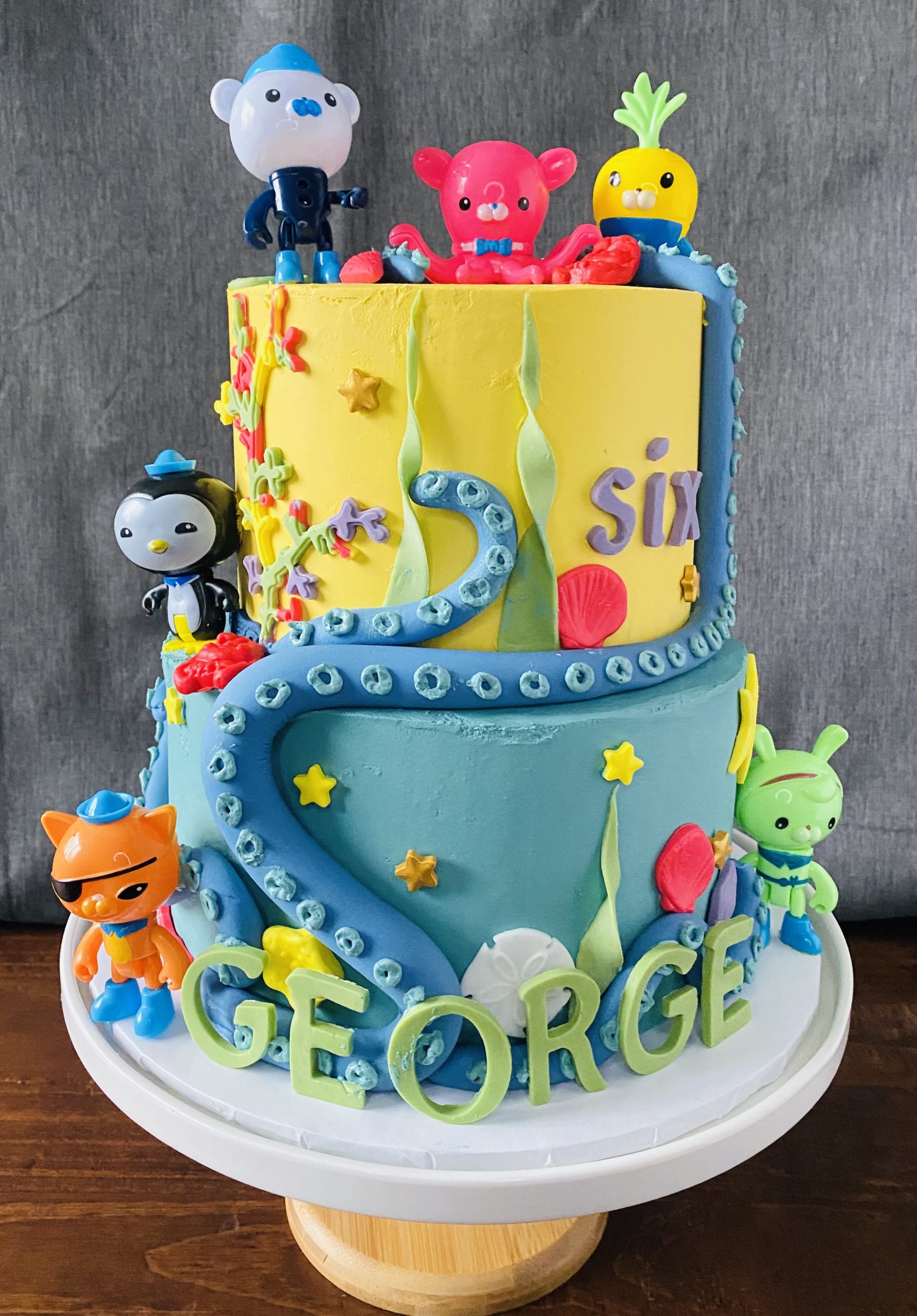 A fantastic children's themed birthday cake with hand-crafted fondant details from Village Patisserie in Toledo, Ohio