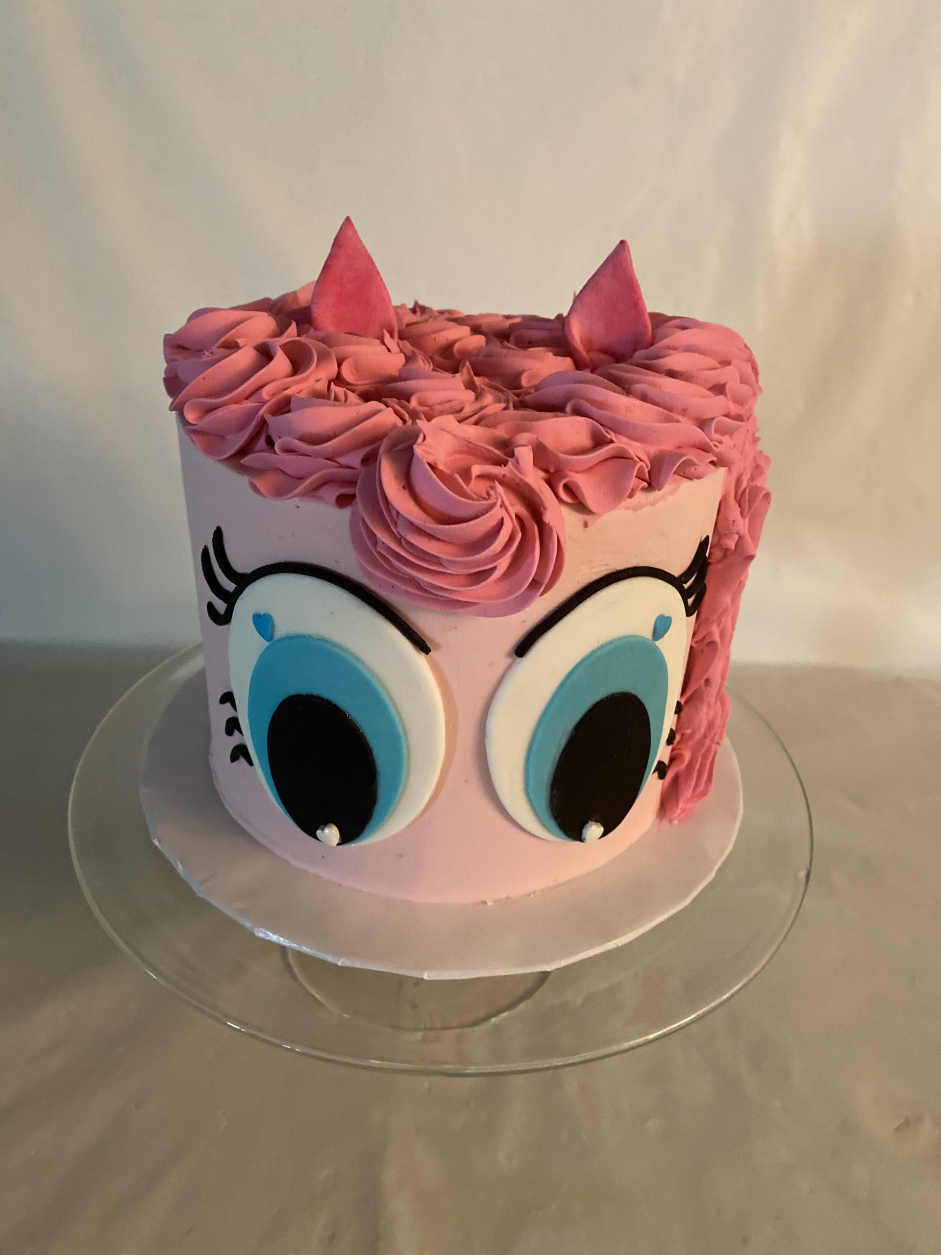 A custom children's birthday cake with hand-crafted fondant details from Village Patisserie in Toledo, Ohio