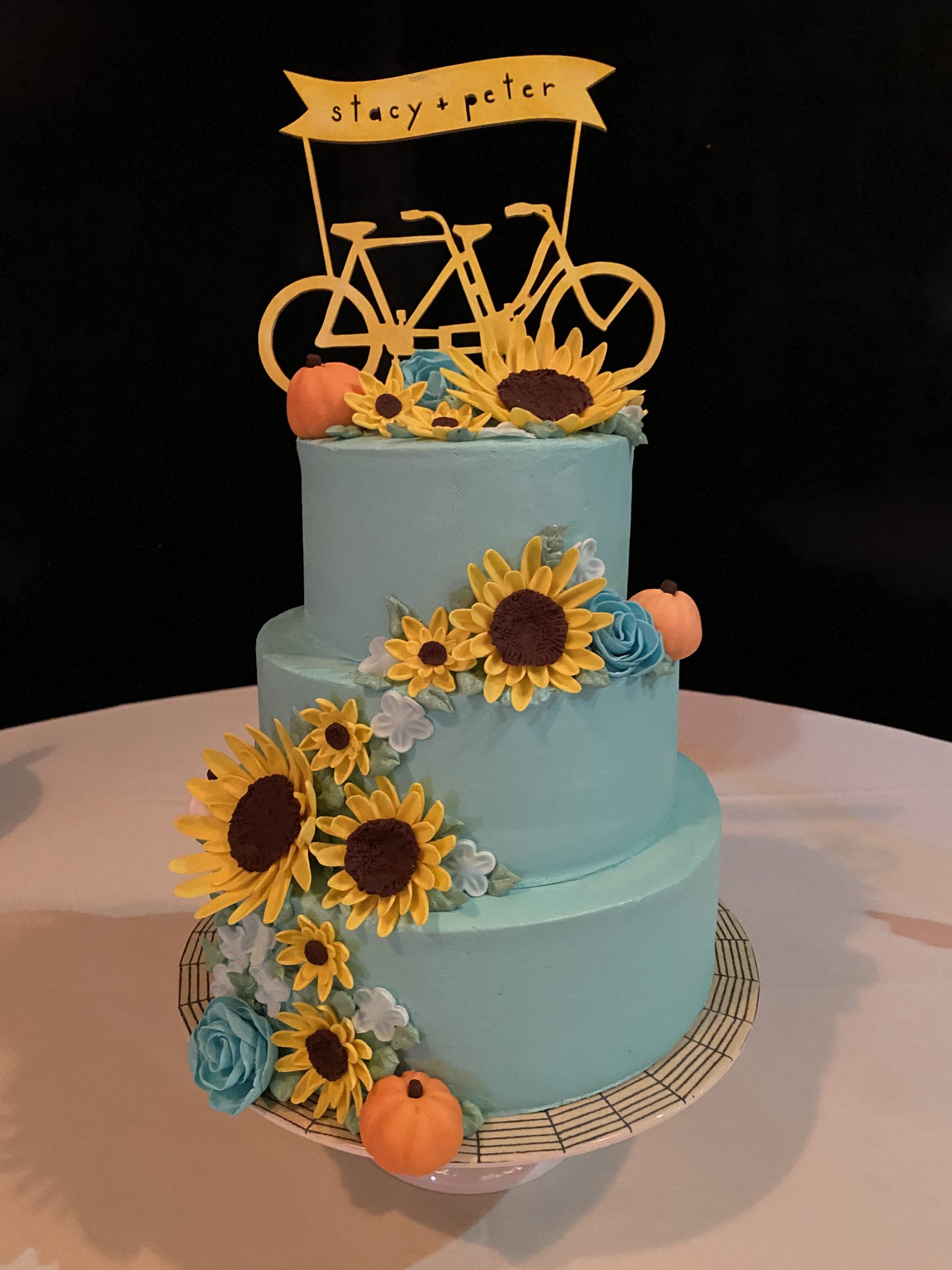 A beautiful 3-tier custom vegan wedding cake with fondant flowers from Village Patisserie in Toledo, Ohio