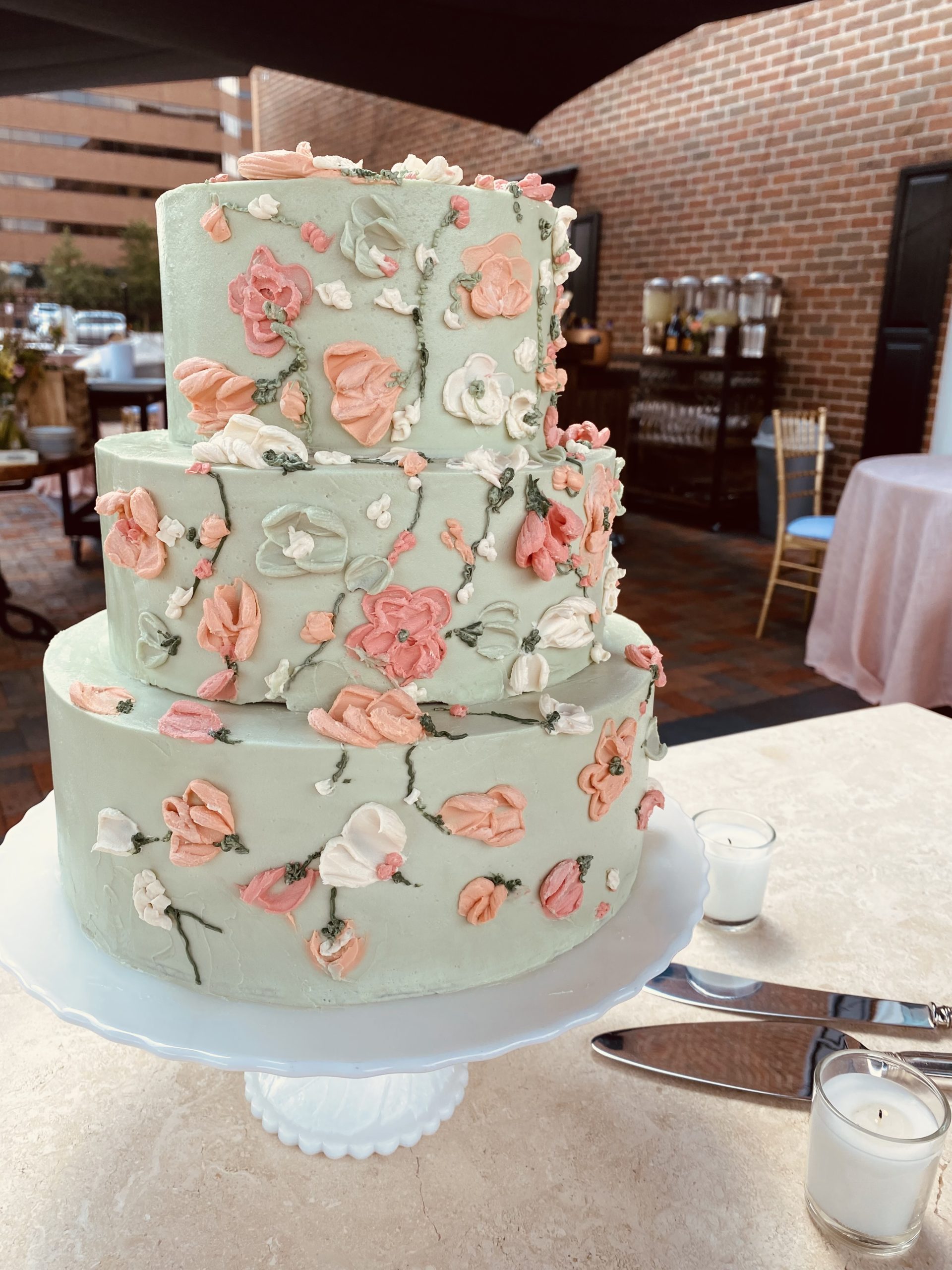 A beautiful 3-tier custom wedding cake with palette knife flowers from Village Patisserie in Toledo, Ohio